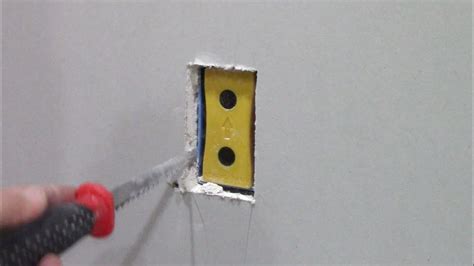 hanging electrical outlet boxes for drywall|installing a new outlet box.